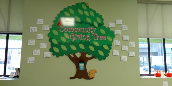 Photo of Community Giving Tree with donor names in dental home